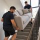 Moving Day Carrying a Sofa Upstairs